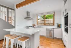 27 Blaxland Avenue Frankston South VIC 3199 $1,050,000 - $1,150,000 Offering an enviable lifestyle within the Frankston High and Overport Primary school zones and in close proximity to Frankston Hospital, Monash University, cafes, Frankston Beach and with Sweetwater Creek Nature Reserve walking trails in walking distance, this family entertainer ticks all the boxes. Set behind electric gates, the elevated home is sure to impress with a neutral colour palette, vaulted ceilings, freshly painted throughout and lush green views providing a relaxed, tropical ambience. An open design flows directly out to the undercover alfresco area, offering the ultimate resort style entertaining space overlooking the solar heated pool area. The first level features a free flowing open plan living with as-new soft grey carpeting and ceiling fan, split system air conditioning and bar. The kitchen is complete with a breakfast bar and brand new appliances including a Bosch dishwasher, Westinghouse double oven and 900mm gas cooktop leading to the dining area with double sliding doors that open out directly to the large undercover decking area. Heading down the hallway, two bedrooms with built-in robes are serviced by the full family bathroom with shower, bath and separate toilet along with a separate powder room for additional convenience. Upstairs you will find the parents retreat or second living with floor to ceiling windows showcasing gorgeous sunset views. The spacious master bedroom hosts ensuite complete with a double shower, walk in robe and split system for added comfort. Extra flexibilities are provided with a fourth bedroom featuring a split system, tranquil views of Sweetwater Creek and access to the roof space for additional home storage. With a double garage and workshop space as well as ample space for the boat or caravan, this light-filled home also includes gas ducted heating, new colourbond roof and custom made plantation shutters.