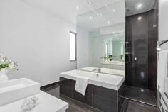 2 Cumberland Ave Balwyn North VIC 3104 Peerless design, impressive proportions and ultra-modern appointments are brilliantly showcased by this sophisticated luxury residence situated moments from Balwyn East shopping village, highly regarded schools, Doncaster Shopping Centre, bus and Eastern Freeway to CBD and Box Hill Shopping Centre. The bold, architectural statement begins the moment you set eyes on the striking front doors which open to immaculate porcelain tiled floor and high ceilings. In the lounge, north-facing full-length windows with doors leading to an expansive and elevated courtyard complement the Jetmaster gas fire, marble topped cabinetry and automatic blinds. A state-of-the-art Miele kitchen with double oven, coffee machine, integrated dishwasher and substantial stone island bench is enhanced by a butler's pantry and glorious alfresco dining with retractable awning; ideal for year-round use. Incorporating sublime interiors and a contemporary colour palette, this home boasts 2 powder rooms and a family bathroom with the latest fixtures including a Villeroy and Boch bath. The opulent main bedroom features a balcony, enormous walk-in robe and ensuite with dual vanity. Two further bedrooms have robes and balcony while the 4th has a fitted study. All bedrooms and 2 living zones each offer independent reverse cycle air-conditioning. With gloss imperite doors throughout, enjoy the home theatre, double remote garage, quality carpets, storage, ducted vacuum, intercom and security system. Land: 716sqm approximately.
