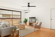 2 / 66 Riverton Street CLAYFIELD QLD 4011 This delightful two-bedroom apartment in one of Brisbane's best suburbs is sure to impress. Situated on the first floor of a well-kept 1970s complex, you'll notice the light and space immediately. There's room to move, relax. With honey-toned wood flooring underfoot, and large windows throughout, the whole apartment feels airy and welcoming. The spacious living and dining area flows to a large, tiled balcony. There's a modern, fitted kitchen with dishwasher, oven and electric cooktop, and lots of storage. The bathroom features a walk-in shower, with monsoon fittings, and attractive cabinetry. Both bedrooms are fully carpeted and feature built-in robes, with extra storage in the hall. The apartment feels cool but for those hot Brisbane summer days, there's air-conditioning in the main living area and fans in both bedrooms. Downstairs, there's secure parking in an extra-large garage, with laundry facilities and internal stairs up to the apartment. The front entrance to the block is also fully secure, with intercom access to each unit. Set on a wide, leafy street, this apartment offers space and style in a superb location just moments from everything. Surrounded by beautiful homes, tree-lined Riverton Street is set right in the heart of one of Brisbane's most established and desirable suburbs. There is excellent access to major schools, shopping centres, and express transport links to the CBD and beyond. It's an easy 400m walk to the buses on Sandgate Road.