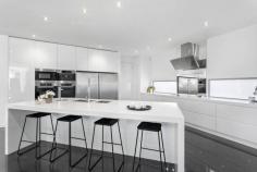 2 Cumberland Ave Balwyn North VIC 3104 Peerless design, impressive proportions and ultra-modern appointments are brilliantly showcased by this sophisticated luxury residence situated moments from Balwyn East shopping village, highly regarded schools, Doncaster Shopping Centre, bus and Eastern Freeway to CBD and Box Hill Shopping Centre. The bold, architectural statement begins the moment you set eyes on the striking front doors which open to immaculate porcelain tiled floor and high ceilings. In the lounge, north-facing full-length windows with doors leading to an expansive and elevated courtyard complement the Jetmaster gas fire, marble topped cabinetry and automatic blinds. A state-of-the-art Miele kitchen with double oven, coffee machine, integrated dishwasher and substantial stone island bench is enhanced by a butler's pantry and glorious alfresco dining with retractable awning; ideal for year-round use. Incorporating sublime interiors and a contemporary colour palette, this home boasts 2 powder rooms and a family bathroom with the latest fixtures including a Villeroy and Boch bath. The opulent main bedroom features a balcony, enormous walk-in robe and ensuite with dual vanity. Two further bedrooms have robes and balcony while the 4th has a fitted study. All bedrooms and 2 living zones each offer independent reverse cycle air-conditioning. With gloss imperite doors throughout, enjoy the home theatre, double remote garage, quality carpets, storage, ducted vacuum, intercom and security system. Land: 716sqm approximately.