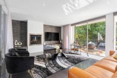 2 Cumberland Ave Balwyn North VIC 3104 Peerless design, impressive proportions and ultra-modern appointments are brilliantly showcased by this sophisticated luxury residence situated moments from Balwyn East shopping village, highly regarded schools, Doncaster Shopping Centre, bus and Eastern Freeway to CBD and Box Hill Shopping Centre. The bold, architectural statement begins the moment you set eyes on the striking front doors which open to immaculate porcelain tiled floor and high ceilings. In the lounge, north-facing full-length windows with doors leading to an expansive and elevated courtyard complement the Jetmaster gas fire, marble topped cabinetry and automatic blinds. A state-of-the-art Miele kitchen with double oven, coffee machine, integrated dishwasher and substantial stone island bench is enhanced by a butler's pantry and glorious alfresco dining with retractable awning; ideal for year-round use. Incorporating sublime interiors and a contemporary colour palette, this home boasts 2 powder rooms and a family bathroom with the latest fixtures including a Villeroy and Boch bath. The opulent main bedroom features a balcony, enormous walk-in robe and ensuite with dual vanity. Two further bedrooms have robes and balcony while the 4th has a fitted study. All bedrooms and 2 living zones each offer independent reverse cycle air-conditioning. With gloss imperite doors throughout, enjoy the home theatre, double remote garage, quality carpets, storage, ducted vacuum, intercom and security system. Land: 716sqm approximately.