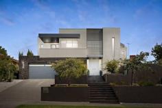 2 Cumberland Ave Balwyn North VIC 3104 Peerless design, impressive proportions and ultra-modern appointments are brilliantly showcased by this sophisticated luxury residence situated moments from Balwyn East shopping village, highly regarded schools, Doncaster Shopping Centre, bus and Eastern Freeway to CBD and Box Hill Shopping Centre. The bold, architectural statement begins the moment you set eyes on the striking front doors which open to immaculate porcelain tiled floor and high ceilings. In the lounge, north-facing full-length windows with doors leading to an expansive and elevated courtyard complement the Jetmaster gas fire, marble topped cabinetry and automatic blinds. A state-of-the-art Miele kitchen with double oven, coffee machine, integrated dishwasher and substantial stone island bench is enhanced by a butler's pantry and glorious alfresco dining with retractable awning; ideal for year-round use. Incorporating sublime interiors and a contemporary colour palette, this home boasts 2 powder rooms and a family bathroom with the latest fixtures including a Villeroy and Boch bath. The opulent main bedroom features a balcony, enormous walk-in robe and ensuite with dual vanity. Two further bedrooms have robes and balcony while the 4th has a fitted study. All bedrooms and 2 living zones each offer independent reverse cycle air-conditioning. With gloss imperite doors throughout, enjoy the home theatre, double remote garage, quality carpets, storage, ducted vacuum, intercom and security system. Land: 716sqm approximately.