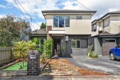 6C Cheddar Rd Reservoir VIC 3073 Live with the luxury of space minus the high-maintenance factor with this family-sized townhouse in the heart of Reservoir! Spanning across two fashionable floors with four spacious bedrooms, two modern bathrooms, high-quality contemporary finishes and indoor-outdoor lifestyle enjoyment, it has all the space you need on a very manageable scale. Warm timber floors flow with style throughout the vast open-plan living domain, overseen by a deluxe kitchen and effortlessly extending onto a private and peaceful backyard ideal for relaxed morning coffees or casual entertaining with friends. Three spacious bedrooms (master with ensuite) are zoned for privacy upstairs, while a fourth bedroom downstairs offers family flexibility. Climate-controlled with split-system heating/cooling, this fantastic first home, smart investment or option for the young family and downsizers also features its own street frontage, high ceilings, plenty of natural light, separate study area, separate laundry, alarm and a single car space. Enhancing your standard of living is the unbeatable lifestyle location, which is within easy walking distance of Broadway and Edwardes Street shops and cafes, Reservoir train station, bus services, schools, Reservoir Leisure Centre and Edwardes Lake Park.
