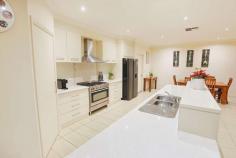 802 Sandilong Avenue Irymple VIC 3498 $749,000 - $823,000 Principal & Elite Sales Agent at Ray White Mildura Damian Portaro is proud to welcome you to a life of comfort at this stunning 912 sqm block in one of Irymple's best locations, crafted by Wayne Mayne Homes. Stepping inside, you'll be greeted by nine-foot ceilings and a separate second living room at the front that perfectly introduces the home's entertaining capacity. The heart of daily living and entertaining is the spacious open-plan kitchen and living area, equipped with natural gas appliances and a walk-in pantry that will please the enthusiastic cook. On offer are four bedrooms, including a master with a walk-in robe and ensuite. Inside are ducted gas heating and evaporative cooling systems that offer comfort all year round. But the real showstopper is the outdoor entertainment area with an inground heated saltwater pool, automatic sprinklers and a 12x5m shed that has partially been converted into an insulated rumpus/granny flat with split system heating and cooling, plus bathroom. With a four-car garage, you'll have plenty of space for all your vehicles.