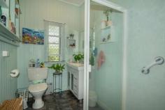 54 Bowen Street Banana QLD 4702 $215,000 Located in Banana, an easy 45km* drive from Biloela and nestled amongst the idyllic surrounds of established gardens, you'll find quite the cozy, cottage retreat. The time has come for this much-loved home to be appreciated by someone new. The interior is blessed with classic tongue and groove timber walls and beautiful, high ceilings throughout to give a real sense of space. The open plan living/dining is air-conditioned with ceiling fans and provides easy access to the kitchen. There are two air-conditioned bedrooms, a very tidy bathroom and a screened rear verandah where you can catch the sunrise or simply relax and take in the beauty of the surrounding gardens. There is also the potential to earn an income with a separate, air-conditioned "granny flat" located away from the main house. This fully self-contained space features an open living area as well as a bathroom and would be the perfect office, home business or extra living quarters. An oversized, double carport separates the flat from the main house. The entire 1485sqm* allotment is fenced with double gate access from the front of the property, into the carport and also via a laneway that runs behind the home.