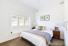 12 Boronia Ave Russell Lea NSW 2046 Timeless elegance combines with contemporary family living in this three-bedroom California bungalow tucked away in a peaceful Russell Lea cul-de-sac. Beautifully presented, the double-fronted home features a light-filled layout with spacious interiors and a seamless flow to a picturesque and secure garden. Whether enjoying time with family or entertaining friends, the covered outdoor dining terrace and level lawn provide the perfect setting for relaxed social gatherings. Authentic period detail retains the home's heritage charm, while thoughtful upgrades, such as stunning floor-to-ceiling bifold doors and sleek custom-built cabinetry, create a fresh and modern living space with ample room for growing families. Conveniently located, the home is only 650m to Russell Lea Public School, 400m to CBD bus routes, and 900mto Wareemba Village. • Charming family home in a prized Russell Lea location • Three queen-sized bedrooms, each with built-in robe and ceiling fan • Sunny open-plan living and dining space with full-length bi-folds • Sleek designer kitchen featuring Smeg oven and unique outdoor serving hatch • Crisp family bathroom including combined bath and shower • Internal laundry with 2nd bathroom featuring large waterfall shower • Private garden with established hedges, covered entertainer's terrace • Retractable garden shades, beautiful Melwood storage shed • Hardwood timber flooring. Air conditioning. Ornate ceilings and leadlight window • Insulated attic storage space. Off street parking.