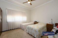 57 Frederic St Midland WA 6056 $399,000 Dream big as you work your magic to transform this 1950s California bungalow into an impressive character home. A wide frontage, elevated situation and original features mark the path toward returning this 3-bedroom, 1-bathroom home to its former glory. An enviable location, steps from Blackadder Creek and La Salle College and minutes from the banks of the Swan River, the home boasts views of the distant Hills, a fully fenced backyard, a brick workshop and a single garage. 3 bedrooms 1 bathroom 1950s Hardi w’board tile Leadlight windows doors High ceilings orig fireplace Large family-style kitchen Powered brick workshop Separate laundry 2nd WC Garage fully fenced b’yard 1120 sqm 30 m frontage Elevated with Hills views There is work to be done, but the rewards could be enormous. With characteristic features, including sturdy tapered pillars, high ceilings and leadlight doors and windows, you will find a sense of nostalgia and inspiration at every turn. A classic front porch with views out to distant hills, a generously proportioned lounge and era-defining leadlight doors and a built-in verandah/sleepout offer ample authentic character and leave no doubt about this property’s origins. High ceilings, original window frames and leadlight, and a kitchen/family room with an ornate ceiling rose and cornices suggest a thoroughly modern future. The main bedroom sits at the front of the plan, a window looking out across the broad front yard. Three junior bedrooms give you a choice when adapting the existing floor plan. The sleepout could be styled as a fabulous sunroom or study looking out to the backyard. In the fully fenced backyard, a partitioned brick workshop, garage and a separate laundry with WC sit amongst vintage rose bushes, grape vines and garden beds waiting to be planted with vegetables. A sheltered, paved area between the home and laundry provides an ideal outdoor entertaining space. Sold on an ‘as is’ basis, the home’s interiors are little changed since built, with 1950s cabinetry in the kitchen and the original tub in the bathroom. The formal lounge features a decorative brick fireplace that could be recommissioned to create an impressive centrepiece. The prize for hard work, vision and perseverance could be an exceptional home with a desirable location. Frederic Street has the air of a hidden gem with its potential just beginning to peak through the surface. Those with an eye for style, heritage and convenience are taking advantage of a great location and a neighbourhood of authentic character homes. Metres from the La Salle College Campus and an easy walk from Ray Marshall Park and the Swan River, the services and amenities of Midland are minutes away, and so too are road and rail links to the CBD and beyond. Don’t miss the opportunity to create an exceptional home in an incredibly central location. Whether you accept the challenge and transform this California bungalow into a modern home or begin again taking advantage of the wide 1120 sqm block (STA), this could be the property or your dreams.