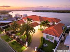 19 Hume Parade Paradise Point QLD 4216 Amidst the secluded enclave of Paradise Point, is this near half acre estate with desirable uninterrupted views of the Northern Gold Coast Broadwater. This Mediterranean Palazzo is the pinnacle of flamboyant and luxurious living and is an opportunity that hasn’t been presented once in the property’s lifespan. From the highly manicured gardens, as you make your way under the Porte cochere, through the double door grand Entrance, you can appreciate the greatness of this residence: The 6-meter-high ceilings, plantation shutters & fireplace combined with the elevated materials including polished timber floors, Italian marbles & natural sandstone are notable features of this property. With multiple living areas over two levels, the property is ideal for families. The mezzanine floor features 3 ensuite bedrooms with own balcony access, a substantial media room and even offers a potential dual living option, with a private self-sufficient apartment upstairs. Downstairs, all living areas open to the outdoors. The palatial master retreat featuring His & Hers Walk-in wardrobes and a decadent plunge pool is your ticket to your own Resort style gateway. Outside, the extensive alfresco & multiple patio area allows you to enjoy the North facing space with its large lawn & swimming pool, crowned by the South Coomera Island views and private river access. Entertainers will relish the commercial standards quality of the bar, entertaining alfresco, formal dining area & the outstanding boating facilities. Features include: • 5 Deluxe ensuite bedrooms, benefiting from their own patio and balconies, overlooking the water. • Mezzanine floor with media room & 3 bedrooms including 1 Suite. • 1 guest room, 1 Study & powder room • Pontoon & boat ramp suitable to Superyacht, 29 feet deep waterway • Fully tiled pool • Elevator • Tasmanian Oak wood kitchen • Granite benchtops • Butler’s pantry • Smeg built-in appliances • Gosford Quarry sandstone tiles • Floor to ceiling tiled bathrooms in imported Italian marble • Ducted air-conditioning, reversed cycle • LED lights throughout and automatic sensor lighting through hallways • Securely gated & CCTV – Cbus alarms and TV monitoring throughout • Solar panels • Fireplace The pines Golf Course 8km – 13min Hope Island Golf Course 8km – 12 min
