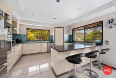12 Jensen Close Coffs Harbour NSW 2450 $950,000 - $1,000,000 Beautifully maintained and immaculately presented, this breathtaking five-bedroom resort style home promises something for the whole family. With north-facing living areas and set on a rare 876 sqm block in a sought after cul-de-sac, the grand-scale two level home is located approximately 10 minutes drive to the beautiful Coffs Creek, boardwalks, shops, cafes, and fantastic golf course. Boasting soaring ceilings, the kitchen and dining area is flooded with natural light and opens to a large wrap around entertaining deck, a surrounding tropical pool and a fully fenced grassed garden area, giving ample opportunity to host guests or just relax with the family. The lower level of the home has a smart and generous floorplan with two bedrooms, bathroom and separate powder room. This makes it great for guests or long-term family visitors, teenagers or parents living with you. Also, on the ground floor you have an oversized double lock-up garage with workbench plus additional storage spaces. Upstairs is a king-sized master bedroom or parents retreat with a large northeast facing covered balcony to enjoy the winter sun plus oversized walk-in robe. Two more generous sized bedrooms, study, a multi-purpose/family room with fireplace and balcony, family bathroom and separate powder room are also on the upper floor. Manicured landscaping and tropical gardens frame this sprawling home which holds a prime position at the end of the cul-de-sac. Flooded with light and offering lifestyle and entertaining zones at every turn - a peaceful retreat or a place for multi-generational activity. Summary of features; - Luxurious five-bedroom home in fantastic location - Generous kitchen with oversized stone benchtops and breakfast bar - Open plan living with soaring ceilings - Covered north facing entertaining deck - Master bedroom retreat with oversized wardrobe and covered balcony - large study with room for two work stations plus storage - Family or multi-purpose room with fire place and balcony - Ground floor with two guest bedrooms, bathroom and powder room - Upper floor guest bedroom with ensuite and balcony - Fully fenced garden with flat grass for pets and kids - Resort style swimming pool - Ducted air conditioning, fans in all rooms - Large solar system - Oversized double lock up garage, work bench storage - Five mins drive to Park Beach Plaza, 10 mins to a multitude of beautiful beaches. - Rear access to the yard with large double gate.