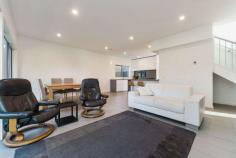 2/5 Clarendon Street Frankston VIC 3199 $670,000 - $737,000 Sparing no expense over two storeys with quality fixtures and finishes and a focus on easy living, this superbly appointed three-bedroom contemporary townhouse delivers carefree comfort in the beating heart of beachside Frankston. Flooded in radiant natural light, spacious interconnected living and dining flows out through glass doors to a private courtyard garden, while an impressive cook's kitchen delights with a waterfall-edge stone breakfast peninsula, gas cooktop, stainless-steel oven, integrated dishwasher and smoky mirrored splashback. Plush carpeting and day-and-night roller blinds adorn all three bedrooms, which are served by a contemporary master ensuite on the lower level and a full modern bathroom upstairs with a bathtub, shower, floating vanity and separate toilet. A study nook with built-in desk, high ceilings with LED lighting, ceramic tiling in the living room and wet areas, fresh tones, ducted heating and a single garage are among the inclusions of this turnkey residence, which will suit starters, investors, couples and families equally. A walkable distance to the train station, beach, Bayside Shopping Centre, restaurants, cinemas, the hospital, Homemaker Centre, Monash University, Chisholm and Frankston Primary School in the Frankston High School zone, this property also ticks every single box for savvy investors.