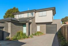 2/5 Clarendon Street Frankston VIC 3199 $670,000 - $737,000 Sparing no expense over two storeys with quality fixtures and finishes and a focus on easy living, this superbly appointed three-bedroom contemporary townhouse delivers carefree comfort in the beating heart of beachside Frankston. Flooded in radiant natural light, spacious interconnected living and dining flows out through glass doors to a private courtyard garden, while an impressive cook's kitchen delights with a waterfall-edge stone breakfast peninsula, gas cooktop, stainless-steel oven, integrated dishwasher and smoky mirrored splashback. Plush carpeting and day-and-night roller blinds adorn all three bedrooms, which are served by a contemporary master ensuite on the lower level and a full modern bathroom upstairs with a bathtub, shower, floating vanity and separate toilet. A study nook with built-in desk, high ceilings with LED lighting, ceramic tiling in the living room and wet areas, fresh tones, ducted heating and a single garage are among the inclusions of this turnkey residence, which will suit starters, investors, couples and families equally. A walkable distance to the train station, beach, Bayside Shopping Centre, restaurants, cinemas, the hospital, Homemaker Centre, Monash University, Chisholm and Frankston Primary School in the Frankston High School zone, this property also ticks every single box for savvy investors.
