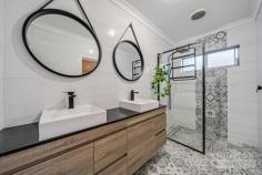 35 Rocklands Loop Carramar WA 6031 $650,000 This stunning 5-bedroom, 2-bathroom property is ready to move straight into & enjoy. Situated in a quiet & sought after street, close by to parks, shopping centres, transport & schools, buyers are urged to act quickly to avoid missing out! Features and benefits include: * Contemporary front elevation * Porch leading to double door entry with security screens * Entrance hall with high ceiling & shoppers’ access from the garage * Master bedroom suite with full height mirrored, sliding robes, feature Hamptons style sliding barn door leading to luxury ensuite with his & hers vanities, stone tops, walk in shower, & separate WC * Built in study area * Huge open plan family, meals & games areas * Stunning chef’s kitchen with granite bench tops, island bench with waterfall ends & breakfast bar, undermount sink, double door pantry, double fridge/freezer recess, wine bottle storage, feature tiled splashbacks, double oven / grill & 900mm cooktop & rangehood * 4 further spacious bedrooms all with built in robes & laminated flooring (one bedroom was previously the home theatre & can be turned back into a home theatre easily) * Family bathroom with bath, shower & vanity * Laundry with linen closet * Further floor to ceiling, sliding door linen/storage closet * Separate WC * Wood style tiles to main areas * LED lighting * Skirting boards to living areas * Amazing outdoor entertaining area with Jarrah decking & built in BBQ * Synthetic lawn areas * Garden shed * Reticulation * Solar electricity system with 18 panels (6.6KW system into 5KW inverter) * Double garage with extra height for four wheel drives / vans * CCTV System * Alarm * 525 sqm block * Situated in a quiet & family friendly street, close to parks & all local amenities