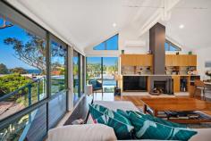 13 Fern Avenue Soldiers Point NSW 2317 With stunning vistas and a privileged location, we present 'Nautilus House'; a home of unparalleled beauty and breath-taking architectural features which come together perfectly to create a flawless seaside lifestyle. The upper level, basked in natural sunlight pouring through an impressive arrangement of glass sliding doors and windows and strategically placed fixed angled windows, is nestled in the coastal surroundings. Find yourself being host to endless celebrations as you prepare decadent meals from your gourmet kitchen, all under a large exposed rafter which accentuates the vast height of the ceiling. The home transitions seamlessly with the seasons. In the warmer months, watch the mid-week yacht races from the large decked balcony and when the weather cools, get cosy by the fireside living and dining spaces. Paired with a beautifully renovated ensuite bathroom, the private upstairs 'parents' retreat' is a tranquil haven. Experience the joys of waking to the sounds of birdlife and drinking your coffee watching the sun rise over the water. The lower level of the home comprises the remaining three bedrooms in a fully self-contained apartment. Fitted with a kitchenette, bathroom, oversized living space, access to the rear yard, shed and an out-of-sight, sun-drenched hills hoist, the opportunities here are endless. If solace is what you're looking for, you can relax in the shaded rear courtyard while you prepare a summer BBQ for family and friends. For use as a luxury bed and breakfast (DA approved) or a long-term tenancy, the lower level is set up and ready to go. Located approximately 350m from the popular Pearson Park and a 1.1km walk to Soldiers Point Marina, tennis courts, boat ramp and other popular local restaurants and amenities, you are right in the heart of the best of idyllic Soldiers Point.