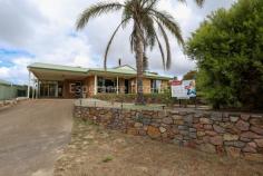 27 Doak Place Castletown WA 6450 Terrific family home with 4 bedrooms, 2 bathrooms, large elegant lounge room with floating floor boards, reverse cycle aircon, tile fire, ceiling fans and huge kitchen with breakfast bar. Wide open family and dining areas, gas bayonets and patio. Rainwater, double carport, 10m x 4m powered workshop. Elevated 809sqm block with direct access to reserve.