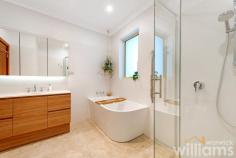 10 Henry Lawson Ave Abbotsford NSW 2046 Flowing over three generous levels, this much-loved property delivers a fantastic opportunity to create a dream family haven in a prime peninsula address. Set on a peaceful Abbotsford street, the expansive home offers plenty of space and exciting potential for an incredible transformation (STCA). Perfect for families of all ages, the flexible layout includes three queen-sized bedrooms, plus plenty of options for play, work, and relaxation. With soothing water views and a private balcony, parents will relish the huge top floor suite that features a separate living space, bedroom, and modern bathroom. Convenient dual access means the large double lock-up garage is easily accessed via the rear laneway. Ideally located, the property is only 250m to Hen & Chicken Bay foreshore, 210m to Abbotsford Public School and 500m to local cafes and retail. • Three-level family home offering endless potential in a highly sought-after address • Top floor parents' retreat with water views, large bedroom, private balcony, bathroom • Three generously sized guest rooms on the second level • Expansive combined living and dining space, featuring access to entertainer's terrace • Bright and well-maintained kitchen includes plenty of bench space and storage • Upgraded bathroom featuring modern deep bath, separate shower, and designer vanity. • Huge lower level featuring internal access and potential as home office, rumpus/games room, or conversion to granny flat (STCA) • Double lock-up garage includes storage space and direct access from laneway at the rear