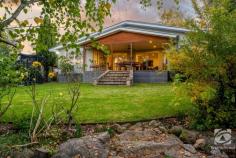  22 Malakoff Road Beechworth VIC 3747 $995,000 - $1,040,000 All the work has been done in this beautifully renovated home with views from every window. Nestled on a generous 1180 sq.m. block with four bedrooms, two bathrooms, three living rooms, plus a study, this home is sure to impress. From the moment you step inside, you'll be captivated by the sleek contemporary design, high-end finishes, and attention to detail throughout. The spacious living and dining areas are filled with an abundance of natural light, creating a warm and inviting ambiance that's perfect for relaxing or entertaining. The kitchen is a chef's dream come true, with stone benchtops, high-end Bosch appliances, and a layout that takes full advantage of the stunning views. You'll love cooking and entertaining in this space, which is light and provides ample space for meal prep and storage. But perhaps the most impressive feature of this home is the stunning views which can be enjoyed from multiple rooms and outdoor spaces. The large rear-covered deck, made from beautiful merbau, is the perfect spot to take in the view across town while enjoying a morning coffee or evening drink. Whether you're sipping your morning coffee on the deck or watching the sunset from the comfort of the master suite, you'll feel like you're living in your own private paradise. With four generously sized bedrooms, there's plenty of space for the whole family to spread out and enjoy. The master bedroom boasts a two way ensuite bathroom, walk-in wardrobe, and of course, those unbeatable views. And with a second stylish bathroom, everyone can enjoy their own slice of luxury. The dedicated study is the perfect space for your uninterrupted professional pursuit. No matter the season, you'll be comfortable thanks to the ducted refrigerated R/C heat cool throughout the home, plus the cosy wood heater for cooler nights. And with 18 solar panels and a 5.4kW inverter, you'll enjoy energy savings for years to come. The double lock-up garage with workshop and additional workroom or home studio provides ample space for cars and hobbyists alike. They even enjoy split system heating and cooling. 