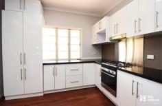 7 Kariboe St Biloela QLD 4715 $350,000 Welcome to 7 Kariboe Street, this split-level home has a lot to offer, including vacant possession and a central location with only a 2-minute walk to Woolworths and Biloela town centre. Let’s start with the bedrooms; there are 4, 2 with cupboards, the main with a WIR and 3 of them have split system air-conditioners. There are also 2 additional rooms that could be used as bedrooms, the options are there if you need a 5th or potentially a 6th bedroom, alternatively you could use these spaces for a home office and storage room. The kitchen features neutral colour tones, an island bench and dishwasher, it flows into the dining area then downstairs to the air-conditioned lounge room. Upstairs is the main bathroom, with a step-in shower and separate tub, downstairs you’ll find a 2nd toilet in the functional laundry. Outside you will be pleasantly surprised by the multiple entertainment areas, one of which includes a bar and built in bench seat, all areas are overlooking the yard space that has child and pet friendly fencing. In addition, you’ll find a large 3 bay powered shed, garden shed, rear lane access, undercover carports at the front and rear of the property and a 680L rainwater tank. The best part is that you can move straight in without waiting for a lease to expire! Your personal inspection can be arranged by calling Amanda or Ross at First National Biloela.