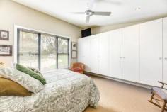 6 William St Bundanoon NSW 2578 $1,450,000 Stunning, contemporary split level home positioned amongst an established Highlands garden ensuring privacy, green vistas from every room and abundant birdlife. The well built and sympathetically designed pavilion style residence offers a versatile floor plan perfect for those starting out or slowing down. The centrally located open plan living features raked ceilings and gas fireplace and ensures a seamless flow to the quality kitchen and separate dining space or potential home library / cosy TV room if needed. A highlight of the home is the stunning high end kitchen with huge Italian stone island, stainless bench tops, quality appliances and exceptional storage options, located directly off the north easterly facing BBQ deck perfect for entertaining and bringing the outside in. The floor plan allows for three bedrooms (currently configured as two beds plus study) and showcases two quality bathrooms with walk-in showers. The main bed is situated in a separate pavilion to the guest bed/office and separated by the expansive casual living area and more formal dining space. The raked ceilings throughout this dwelling add to the feeling of space and the double glazed windows and doors ensure the solar passive home remains warm in the Highlands winters and cool in the summertime. A well insulated home with all town services plus heating and cooling options throughout. Construction is a mix of colourbond, timber and rendered villa board and the quality fit out is evident on arrival with hardwood floors, lovely finishes and excellent storage options plus a cleverly positioned European laundry. The private verandah under roof takes in lovely views over the gardens and sweeping lawn area. The well planted and established garden of ornamentals also offers meandering pathways around the home plus the property is well fenced with pedestrian access off William Street to the covered entryway. Parking is accessed via Mangold Lane and offers 3 parking bays with scope to add a carport or garage if required. There is a sizeable garden shed tucked into the colourful surrounds alongside the 10,000litre water tank and veggie beds. A fabulous home within a short, level walk to the village, shops and station, lovingly maintained and offering easy village living.