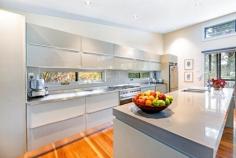 6 William St Bundanoon NSW 2578 $1,450,000 Stunning, contemporary split level home positioned amongst an established Highlands garden ensuring privacy, green vistas from every room and abundant birdlife. The well built and sympathetically designed pavilion style residence offers a versatile floor plan perfect for those starting out or slowing down. The centrally located open plan living features raked ceilings and gas fireplace and ensures a seamless flow to the quality kitchen and separate dining space or potential home library / cosy TV room if needed. A highlight of the home is the stunning high end kitchen with huge Italian stone island, stainless bench tops, quality appliances and exceptional storage options, located directly off the north easterly facing BBQ deck perfect for entertaining and bringing the outside in. The floor plan allows for three bedrooms (currently configured as two beds plus study) and showcases two quality bathrooms with walk-in showers. The main bed is situated in a separate pavilion to the guest bed/office and separated by the expansive casual living area and more formal dining space. The raked ceilings throughout this dwelling add to the feeling of space and the double glazed windows and doors ensure the solar passive home remains warm in the Highlands winters and cool in the summertime. A well insulated home with all town services plus heating and cooling options throughout. Construction is a mix of colourbond, timber and rendered villa board and the quality fit out is evident on arrival with hardwood floors, lovely finishes and excellent storage options plus a cleverly positioned European laundry. The private verandah under roof takes in lovely views over the gardens and sweeping lawn area. The well planted and established garden of ornamentals also offers meandering pathways around the home plus the property is well fenced with pedestrian access off William Street to the covered entryway. Parking is accessed via Mangold Lane and offers 3 parking bays with scope to add a carport or garage if required. There is a sizeable garden shed tucked into the colourful surrounds alongside the 10,000litre water tank and veggie beds. A fabulous home within a short, level walk to the village, shops and station, lovingly maintained and offering easy village living.