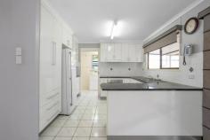 39 INVESTIGATOR STREET ANDERGROVE QLD 4740 $349,000 This lovely, neat & well-maintained property will be perfectly suited to a downsizing couple ready to retire, a first home buyer looking for a stepping-stone property, or a savvy investor looking for a wise acquisition - this property is bursting with potential. Some tasteful renovations have increased both the aesthetics and functionality of the home with a large, modern kitchen & a floor-to-ceiling tiled bathroom. The welcoming streetscape offers a double-open carport leading to the tiled front patio. Step inside to a vast open plan, fully tiled lounge, kitchen, and dining area with a large capacity split system air conditioner plus the flow of fresh air from the front windows and door to the sliding glass doors located in the dining room at the rear of this large, open space. The beautiful kitchen contains copious cabinets and drawers for storage, including a pantry cupboard, a large fridge cavity, and easy-clean laminated benchtops with tiled splashbacks. Existing appliances include the electric oven, stovetop, and range hood. Step through the sliding doors into a large covered and tiled outdoor entertaining area that runs the entire length of the house & boasts a lovely view of the greenhouse area & large, fully fenced backyard. Leading from the kitchen is the large, tiled laundry with plenty of space for appliances, including perhaps a second fridge. A real bonus to this home is the large air-conditioned rumpus room that was originally the garage but could be converted to present an array of possible functions, from a home office to a rumpus room or even a media room. The two bedrooms are carpeted, one with air conditioning and a built-in robe and ceiling fan. The second bedroom receives refreshing cross-flow ventilation thanks to the two large screened windows. The bathroom has been tastefully renovated with floor-to-ceiling tiles, a walk-in shower, single vanity, and a shaving cabinet. For privacy, there is a separate toilet. Space to park vehicles won't be a problem as the double carport is located at the front of the home but also allows side access directly to the two-bay shed that is powered and fully lockable.