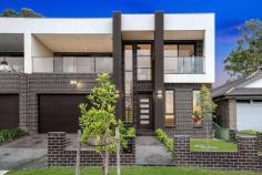 141A Birdwood Road Georges Hall NSW 2198 Showcasing a new standard in flawless family living, this master built home offers immersive indoor/outdoor flow with high-end contemporary finishes and boundless space. It unfolds over a versatile dual-level layout and displays custom finishes and an abundance of natural sunlight throughout. This ultra-modern residence is peacefully located close to Georges Hall Village, public transport, playing fields, popular local schools and Lake Gillawarna. Property Features Include: Full-length glass windows and doors enhance the living spaces Seamless outdoor flow to an all-season alfresco with ceiling fans Covered alfresco includes a gas kitchenette and attached to a well landscaped private yard Bespoke kitchen with stone benches & gas Electrolux appliances Four large sun drenched bedrooms with built-ins & private balcony's Marble-look bathroom with rainwater shower, freestanding bath Ducted air-conditioning, shadow line ceilings, drop light fitting Grand frontage with cobblestone walkways Extensive balcony off the first floor enjoys elevated urban views Double automatic garage with internal access, timber staircase TV antennas in all bedrooms including garage & high ceilings on both levels Highly sought-after street close to everyday amenities and cafes Whether you are seeking a place to call home or an astute investment, look no further than this incredible duplex. Inspection is highly recommended to truly appreciate this magnificent offering to the Georges Hall market.