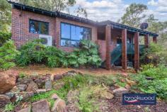 485 Johnston Rd Parkerville WA 6081 $625,000 Nestled amongst the trees at the top of the driveway, the allure of this hills home is further heightened by its seamless integration with the surrounding landscape. This charming brick and tile character home boasts three bedrooms plus study, a modern kitchen and a new stylish bathroom. 3 x 1 plus study brick & tile High cathedral ceilings Split level home 2 living zones Wide front balcony Modern kitchen Renovated bathroom Outdoor alfresco Natural landscape Close to heritage trial, schools, Tavern Each level of this dwelling exudes its own distinct charm. Set against a backdrop of towering trees, the main level showcases beautiful views of the surrounding landscape, allowing residents to wake up to nature’s splendor each morning. This level is a harmonious blend of open-concept living spaces, cathedral ceilings soaring above and cozy corners, where the central focal point is the inviting wood burner that emanates warmth throughout. Ascending to the upper level reveals three bedrooms, that provide space for relaxation and rejuvenation, a renovated stylish bathroom and access to a private outdoor rear alfresco. The majestic trees that encircle the property create a sense of privacy and seclusion, offering a peaceful haven away from the hustle and bustle of everyday life. Whether enjoying the simple pleasure of sipping a cup of hot coffee by the fire, sitting on the balcony soaking up the view or exploring the beauty of the hills, this character home provides a sanctuary where one can truly connect with nature and find respite from the demands of the outside world.
