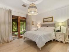 6 Dyer Court URAIDLA SA 5142 $990,000 - $1,020,000 Upon arriving at the property you are graced by a glorious autumn garden and met with the serenity of Hills lifestyle. Set on 2,107m2 (approx.) of well-maintained gardens and a native outlook from the wraparound bullnose verandah. Leadlight glass surrounds the front door when entering the home you are welcomed with a warm homely feel. Double timber doors lead to the spacious lounge room with views to the garden from the French doors, new timber floating floorboards and ornate ceiling rose. Solid timber Tasmanian Oak kitchen with electric glass cooktop, wall oven and dishwasher adjacent open family / dining room leading through French doors to outdoor verandah and large paved undercover entertaining area, perfect for family gatherings. Three generous sized bedrooms all with their own access to the bullnose verandah, main bedroom with walk-in wardrobe and ensuite. Family bathroom with separate shower, full sized bath and timber vanity, separate toilet and large laundry with ample cupboard space. The exterior grounds including a double garage with remote control door. Ducted reverse cycle air-conditioning complete the home. Key features: • Hills property surrounded by glorious gardens • Three bedrooms, main with ensuite & WIR • Tasmanian Oak kitchen with dishwasher • Spacious lounge & separate family / dining • Family bathroom with shower & bath • Double garage with remote door • Ducted reverse cycle air-conditioning