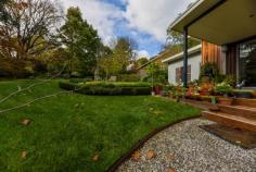 6 William St Bundanoon NSW 2578 $1,450,000 Stunning, contemporary split level home positioned amongst an established Highlands garden ensuring privacy, green vistas from every room and abundant birdlife. The well built and sympathetically designed pavilion style residence offers a versatile floor plan perfect for those starting out or slowing down. The centrally located open plan living features raked ceilings and gas fireplace and ensures a seamless flow to the quality kitchen and separate dining space or potential home library / cosy TV room if needed. A highlight of the home is the stunning high end kitchen with huge Italian stone island, stainless bench tops, quality appliances and exceptional storage options, located directly off the north easterly facing BBQ deck perfect for entertaining and bringing the outside in. The floor plan allows for three bedrooms (currently configured as two beds plus study) and showcases two quality bathrooms with walk-in showers. The main bed is situated in a separate pavilion to the guest bed/office and separated by the expansive casual living area and more formal dining space. The raked ceilings throughout this dwelling add to the feeling of space and the double glazed windows and doors ensure the solar passive home remains warm in the Highlands winters and cool in the summertime. A well insulated home with all town services plus heating and cooling options throughout. Construction is a mix of colourbond, timber and rendered villa board and the quality fit out is evident on arrival with hardwood floors, lovely finishes and excellent storage options plus a cleverly positioned European laundry. The private verandah under roof takes in lovely views over the gardens and sweeping lawn area. The well planted and established garden of ornamentals also offers meandering pathways around the home plus the property is well fenced with pedestrian access off William Street to the covered entryway. Parking is accessed via Mangold Lane and offers 3 parking bays with scope to add a carport or garage if required. There is a sizeable garden shed tucked into the colourful surrounds alongside the 10,000litre water tank and veggie beds. A fabulous home within a short, level walk to the village, shops and station, lovingly maintained and offering easy village living.