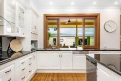 65 French St Netherby SA 5062 $1,850,000 - $1,975,000 Welcome to what may become, your new, fabulous family home. This fully renovated and extended sandstone fronted bungalow, built in the 1950's, radiates elegance and charm. Nestled on a generous 945sqm allotment, this home offers a perfect blend of vintage allure and modern amenities, perfect for you and your family. Walking through the gates of the picket fence and stepping up onto the welcoming, elevated verandah overlooking the manicured front garden, you are home. Open the front door, with its stained-glass windows, and be greeted with a stunning, wide, long entrance hall that shows off the polished timber floors which are a feature throughout the home, along with the high ceilings. You will now begin to truly appreciate just how wonderful this home really is. We offer you 4 spacious bedrooms, (or 3 bedrooms plus a bright and airy study.) The main bedroom has an ensuite, with double vanity, a walk-in robe plus built in robes. The second and third bedrooms are queen sized rooms, with the second bedroom including a built-in robe. Theses bedrooms share the large family bathroom, that features a spa bath, and is adjacent to the laundry that has an abundance of storage with floor to ceiling cabinets, plus access via the attic staircase to the ceiling space with its 12sqm of structural floor. At the end of the hallway, the home really opens as you are drawn to its heart – the expansive open plan kitchen / dining /living area. You will be impressed by the massive, stunning gourmet kitchen featuring black granite bench tops, induction cooktop and double wall ovens. It effortlessly blends classic charm with contemporary convenience and will rapidly become the place where everyone gathers to catch up on the days activities. Open the café windows above the sink, to give you direct serving access to the paved outdoor entertaining space, located under the main roof of the house. Step through the full height French doors leading off the living area and on to the patio and be seduced by the sparkling in ground pool – and there is still plenty of room for a game of back yard cricket on the lawned area. To cap all of this off, at the back of the property, extending the full 16.5m width of the block, is a 4 car garage plus a room for a full workshop or gym! Behind the 4 roller doors can store your car collection in complete safety with room to work on them in comfort (and peace). If you wanted to update the workshop / gym by adding a bathroom, easily done as plumbing is accessible and power is provided. For your daily drives, we have undercover, secure parking with the 3 car length carport offering direct access into the home. The home has solar panels installed providing approximately 7kW of power generation and you will be kept comfortable with the ducted reverse cycle air conditioning throughout. Being located near to Mitcham Primary, Unley High School, Urrbrae High School, Scotch College and Mercedes College plus a comfortable walk or very short drive to Mitcham Shopping Centre, bus and train stops, all the required amenities are taken care of. This one ticks all the boxes for those looking for a stunning home with plenty of room for all the family, an abundance of indoor and outdoor entertaining space – plus undercover and secure garaging for 7 cars!