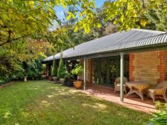 6 Dyer Court URAIDLA SA 5142 $990,000 - $1,020,000 Upon arriving at the property you are graced by a glorious autumn garden and met with the serenity of Hills lifestyle. Set on 2,107m2 (approx.) of well-maintained gardens and a native outlook from the wraparound bullnose verandah. Leadlight glass surrounds the front door when entering the home you are welcomed with a warm homely feel. Double timber doors lead to the spacious lounge room with views to the garden from the French doors, new timber floating floorboards and ornate ceiling rose. Solid timber Tasmanian Oak kitchen with electric glass cooktop, wall oven and dishwasher adjacent open family / dining room leading through French doors to outdoor verandah and large paved undercover entertaining area, perfect for family gatherings. Three generous sized bedrooms all with their own access to the bullnose verandah, main bedroom with walk-in wardrobe and ensuite. Family bathroom with separate shower, full sized bath and timber vanity, separate toilet and large laundry with ample cupboard space. The exterior grounds including a double garage with remote control door. Ducted reverse cycle air-conditioning complete the home. Key features: • Hills property surrounded by glorious gardens • Three bedrooms, main with ensuite & WIR • Tasmanian Oak kitchen with dishwasher • Spacious lounge & separate family / dining • Family bathroom with shower & bath • Double garage with remote door • Ducted reverse cycle air-conditioning