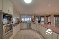 5 Iris Pl Pakenham VIC 3810 $740,000 - $814,000 Welcome to your ultimate haven, a fantastic four-bedroom plus study residence that redefines comfort and style. Set on a generous 645m² allotment and positioned only a short stroll away from Heritage Springs Shopping complex, enjoy this home's convenience with key amenities right on your doorstep. As you step inside be impressed with the size and design of this home. Beginning with the master bedroom at the front of the home with a walk-in robe and ensuite, the secondary bedrooms are at the rear, have double built-in robes, and have easy access to the main bathroom and separate toilet. Enjoy three separate living areas providing versatility and options for relaxation and recreation. The main living and dining domains are open-plan and light-filled. The gourmet kitchen is a chef’s delight being large in design, hosting high-quality appliances, a dishwasher, an array of storage, a walk-in pantry, and plenty of bench space. Moving outside be amazed by the huge 16m x 7.4m covered outdoor entertaining area allowing space to host family and friends, store boats/caravans with drive-through access from the garage, or simply just sit back, relax, and unwind. Additional benefits include a formal dining area, study, large laundry, ducted heating throughout, evaporation cooling, an abundance of storage, and oversized remote double car accommodation.