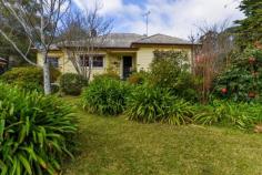 73 Railway Ave Bundanoon NSW 2578 $1,195,000 This character 1950s weatherboard cottage set in a pretty Highlands garden will pull at your heart strings. Retaining all the charm of years gone with the modern conveniences one would expect. Easy level living plus a short stroll to village shops, cafes, station and school. High points Excellent northern aspect ensuring a warm sun filled home Three generous living spaces all of which flow seamlessly to one another and the newly renovated kitchen Vintage gas Aga is a highlight of the kitchen/dining space, perfect additional cooking appliance and warms the home Kitchen overlooks the front and side garden and has direct access to the sunroom and entertaining deck Cosy lounge also accesses both dining and sunroom via French doors and warmed via the slow combustion fireplace, a great winter room All three beds are generous in size and offer varying degrees of storage options from small cupboards to gorgeous ornate robes with built-in dressing table Both bathrooms are in good condition, the main bath houses a bath, shower, wc and pedestal vanity whilst the second bath also offers the European laundry Adding to the charm and convenience of the home is 9ft ceilings, timber floorboards, picture rails, split a/c in the family/kitchen space and all town services Externally the home offers a free standing studio, a great work from home space, a generous garden shed and a lovely paved rear terrace and pathway through the garden Parking is via the double carport with plenty of extra off street parking if needed Fully enclosed rear garden perfect for pets plus a lovely array of trees, shrubs and garden beds