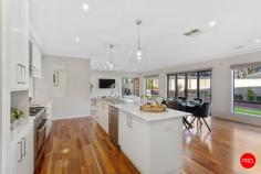 6 Kadina Court Strathfieldsaye VIC 3551 $750,000 - $810,000 Peacefully situated in a small boutique estate, within 5 mins walk to schools, shops and sporting fields is this quality Dennis Family build is full of extra's. This property has been meticulously cared for, it presents brand new and backs onto a treed reserve within a quiet neighbourhood with limited surrounding development. The home delivers an idyllic blend of easy low maintenance living and features 4 different living zones. The beautiful Hamptons-style kitchen is packed full of extras with an extra-long island bench making meal preparation easy. 20mm stone benchtops, 900mm high-quality stainless-steel oven and gas cooktop, walk-in pantry and feature pendant lighting for an extra hit of style and ambience to this space. Complementing the Hamptons style lighting are the feature plantation shutters tying the whole look together. Step through the second living area to the third living which then opens up to the undercover decked alfresco area. This alfresco also has a handy entrance to the main bedroom which will be perfect for the parents to enjoy on a balmy night before slipping off to bed. The backyard has been impressively landscaped and offers an irrigation system to keep the garden lush and hydrated. There's a huge amount of grassed area's as well perfect for the kids to run around on and play. Bedroom accommodation comprises a stunning master suite complete with a big walk-in robe and an ensuite with dual basins and a slightly bigger shower. While the remaining three sizable robed bedrooms share a stylish family bathroom with a separate toilet. The fourth living area is located in the accommodation wing and is currently being used as a study/office but could also be set up as a children's living/play zone. More inclusions to mention: The entire home is temperature-controlled with ducted heating and cooling throughout plus added ceiling fans in the bedrooms. There's a full-sized laundry with a walk-in linen cupboard, an extra wide double lockup remote-controlled garage with internal access and paved side access to get your trailer or caravan off the street. Situated in the highly sought-after Strathfieldsaye, you will be a stone's throw from both primary schools, supermarkets and medical facilities, which is within a 700-metre walk.