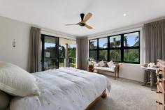 1 Vita Bella Court Currumbin Valley QLD 4223 “Vita Bella” is the essence of a beautiful life, and that's precisely what awaits with this single-level sanctuary. A former BoysTown Prize Home that backs onto an idyllic nature reserve, it sprawls across a lush 1 acre allotment to blend timeless allure with modern luxuries. Fresh, light-filled and north-facing, step inside and indulge in a symphony of elegance and comfort. A sleek and spacious kitchen with stone waterfall-edge island bench, stainless steel appliances and large walk-in pantry takes its place as the heart of the home, overlooking an expansive and open plan living and dining area. Here, full-height glass windows frame glistening pool views while an in-set gas fireplace adds cosy charm. There's also a media room to relax in, plus four bedrooms promise rest and rejuvenation. The master suite is particularly peaceful, with this private oasis tucked away from the remaining bedrooms. Infinitely indulgent, soak away any stress in the luxe spa while savouring valley views, or enjoy this scenic outlook from your exclusive-use deck. Outdoors, embrace effortless alfresco entertaining on the vast terrace or take advantage of the supersized, wraparound resort-style pool. Glorious established gardens surround the allotment in greenery, with a charming summer creek adding to the outside enchantment, winding its way through this fully fenced block. Nestled in a sought-after setting, this location radiates pure tranquillity. Meandering walkways line the creek edge, delivering you to the famed Pasture and Co Café at the Eco Village or local picturesque parks. In six minutes, arrive at Currumbin Fair or sample the sand and sea with Currumbin Beach, Palm Beach, and vibrant Burleigh Heads all within approx. 12-17 minute's drive. Add easy access to schools and the airport, and you'll soon see why this is “a beautiful life”! Arrange an inspection today. House Features Effortlessly modern single-level sanctuary Fresh and light-filled, with polished hardwood flooring throughout Portico entry, opens to a foyer via stately double doors, with immediate pool views Sleek and spacious kitchen with stone waterfall-edge island bench, large walk-in pantry and stainless steel appliances (including a 4 burner gas cooktop, built-in convection microwave and oven) Vast, open plan living and dining area with built-in cabinetry, feature wall with in-set gas fireplace and full-height glass windows framing pool views Media room Oversized master suite with walk-in robe with built-in cabinetry, private deck overlooking lush acreage and a contemporary ensuite with double vanity, double shower and luxe spa Three bedrooms with built-in robes, two with access outdoors Study nook with built-in desk Elegant three-way main bathroom Powder room Tiled alfresco entertaining area accessed via bi-fold doors, overlooking pool with sunshades, fan, and lighting Supersized, wraparound resort-style pool Laundry with ample storage Double garage with storage Ducted air-conditioning throughout Property Features North-facing on a lush 1 acre allotment, backs onto a beautiful nature reserve Former BoysTown Prize Home Summer creek meandering through the grounds Fully fenced, with electric entrance gate Side access gate and additional parking Water tank Envirocycle Raised vegetable gardens Greenhouse Double bay work-shed with power Location Approx. 5 mins from IGA/Currumbin Fair Approx. 6 mins from St. Augustine's Parish Primary School Approx. 10 mins from Currumbin Beach Approx. 12 mins from Palm Beach Approx. 15 mins from Gold Coast Airport Approx. 17 mins from Burleigh Heads Approx. 37 mins from Surfers Paradise