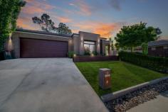 6 Kadina Court Strathfieldsaye VIC 3551 $750,000 - $810,000 Peacefully situated in a small boutique estate, within 5 mins walk to schools, shops and sporting fields is this quality Dennis Family build is full of extra's. This property has been meticulously cared for, it presents brand new and backs onto a treed reserve within a quiet neighbourhood with limited surrounding development. The home delivers an idyllic blend of easy low maintenance living and features 4 different living zones. The beautiful Hamptons-style kitchen is packed full of extras with an extra-long island bench making meal preparation easy. 20mm stone benchtops, 900mm high-quality stainless-steel oven and gas cooktop, walk-in pantry and feature pendant lighting for an extra hit of style and ambience to this space. Complementing the Hamptons style lighting are the feature plantation shutters tying the whole look together. Step through the second living area to the third living which then opens up to the undercover decked alfresco area. This alfresco also has a handy entrance to the main bedroom which will be perfect for the parents to enjoy on a balmy night before slipping off to bed. The backyard has been impressively landscaped and offers an irrigation system to keep the garden lush and hydrated. There's a huge amount of grassed area's as well perfect for the kids to run around on and play. Bedroom accommodation comprises a stunning master suite complete with a big walk-in robe and an ensuite with dual basins and a slightly bigger shower. While the remaining three sizable robed bedrooms share a stylish family bathroom with a separate toilet. The fourth living area is located in the accommodation wing and is currently being used as a study/office but could also be set up as a children's living/play zone. More inclusions to mention: The entire home is temperature-controlled with ducted heating and cooling throughout plus added ceiling fans in the bedrooms. There's a full-sized laundry with a walk-in linen cupboard, an extra wide double lockup remote-controlled garage with internal access and paved side access to get your trailer or caravan off the street. Situated in the highly sought-after Strathfieldsaye, you will be a stone's throw from both primary schools, supermarkets and medical facilities, which is within a 700-metre walk.