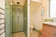 15 William St Bundanoon NSW 2578 $895,000 Charming, compact cottage with a touch of quirky 1960s, set in a highly sought after location, the gorgeous bank of windows to the north ensure the living, dining and kitchen space is bathed in natural light. The deep front deck off the entry offers extra living / entertaining in the warmer months. A gorgeous property at a great price in the village of Bundanoon. High points Excellent northern aspect ensuring a warm sun filled home via the Magnetite retrofit double glazing system The quaint kitchen has been fully renovated with space saver dishwasher, stone benches and breakfast bar The main bath has also been fully renovated with shower, wc and timber vanity plus the laundry offers a second wc A very flexible floorplan, currently configured as a two bedroom residence but the 3rd utilities room would make a great work from home space, guest accommodation or artist’s studio Adding to the charm of the cottage are the high raked ceilings on entry and throughout the living, dining and kitchen space which also offers rear access to the paved terrace area perfect for further entertaining and BBQing Externally the home offers a free standing near new garden shed, plus smaller storage / bike shed and relatively good fencing, with a single carport to the front and plenty of off street parking Heating and cooling is via the gas ducted heater + split system a/c and further enhanced via the double glazed windows, new roof and insulation The park like grounds are low maintenance with sweeping lawn areas, hedging, some garden beds and planting to the streetscape ensuring further privacy Fabulous location offering an easy stroll to the village and all it has to offer