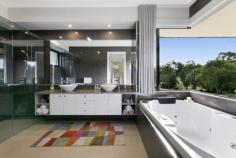 1 Vita Bella Court Currumbin Valley QLD 4223 “Vita Bella” is the essence of a beautiful life, and that's precisely what awaits with this single-level sanctuary. A former BoysTown Prize Home that backs onto an idyllic nature reserve, it sprawls across a lush 1 acre allotment to blend timeless allure with modern luxuries. Fresh, light-filled and north-facing, step inside and indulge in a symphony of elegance and comfort. A sleek and spacious kitchen with stone waterfall-edge island bench, stainless steel appliances and large walk-in pantry takes its place as the heart of the home, overlooking an expansive and open plan living and dining area. Here, full-height glass windows frame glistening pool views while an in-set gas fireplace adds cosy charm. There's also a media room to relax in, plus four bedrooms promise rest and rejuvenation. The master suite is particularly peaceful, with this private oasis tucked away from the remaining bedrooms. Infinitely indulgent, soak away any stress in the luxe spa while savouring valley views, or enjoy this scenic outlook from your exclusive-use deck. Outdoors, embrace effortless alfresco entertaining on the vast terrace or take advantage of the supersized, wraparound resort-style pool. Glorious established gardens surround the allotment in greenery, with a charming summer creek adding to the outside enchantment, winding its way through this fully fenced block. Nestled in a sought-after setting, this location radiates pure tranquillity. Meandering walkways line the creek edge, delivering you to the famed Pasture and Co Café at the Eco Village or local picturesque parks. In six minutes, arrive at Currumbin Fair or sample the sand and sea with Currumbin Beach, Palm Beach, and vibrant Burleigh Heads all within approx. 12-17 minute's drive. Add easy access to schools and the airport, and you'll soon see why this is “a beautiful life”! Arrange an inspection today. House Features Effortlessly modern single-level sanctuary Fresh and light-filled, with polished hardwood flooring throughout Portico entry, opens to a foyer via stately double doors, with immediate pool views Sleek and spacious kitchen with stone waterfall-edge island bench, large walk-in pantry and stainless steel appliances (including a 4 burner gas cooktop, built-in convection microwave and oven) Vast, open plan living and dining area with built-in cabinetry, feature wall with in-set gas fireplace and full-height glass windows framing pool views Media room Oversized master suite with walk-in robe with built-in cabinetry, private deck overlooking lush acreage and a contemporary ensuite with double vanity, double shower and luxe spa Three bedrooms with built-in robes, two with access outdoors Study nook with built-in desk Elegant three-way main bathroom Powder room Tiled alfresco entertaining area accessed via bi-fold doors, overlooking pool with sunshades, fan, and lighting Supersized, wraparound resort-style pool Laundry with ample storage Double garage with storage Ducted air-conditioning throughout Property Features North-facing on a lush 1 acre allotment, backs onto a beautiful nature reserve Former BoysTown Prize Home Summer creek meandering through the grounds Fully fenced, with electric entrance gate Side access gate and additional parking Water tank Envirocycle Raised vegetable gardens Greenhouse Double bay work-shed with power Location Approx. 5 mins from IGA/Currumbin Fair Approx. 6 mins from St. Augustine's Parish Primary School Approx. 10 mins from Currumbin Beach Approx. 12 mins from Palm Beach Approx. 15 mins from Gold Coast Airport Approx. 17 mins from Burleigh Heads Approx. 37 mins from Surfers Paradise