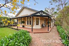 40 Knightsbridge Rd Hazelwood Park SA 5066 With a valuable corner position on a wide treelined street, this captivating return veranda villa sits in the heart of one of Adelaide’s most coveted eastern suburbs. Its bright contemporary aesthetic celebrates exquisite period details, whilst its extended floorplan offers space and versatility for those seeking a family home with the perfect lifestyle location. Nestled behind a picket fence, the dappled front garden reveals a picturesque sandstone frontage with tessellated tiled veranda and leadlight windows. The hallway featuring pine boards and lofty ceilings, brushes past original rooms with highly decorative plaster ceilings and fireplaces, towards open plan family living. Principal rooms are highly flexible in function, and currently comprise a chic living room plus four bedrooms, or three plus a home office. The generously proportioned primary bedroom forms a stylish retreat, with built-in robe and large ensuite bathroom. Family life centres around light filled open plan living, grounded by superb Mediterranean style floors drenched in light from feature paned windows and a glorious garden backdrop. At centre stage is the all-white kitchen with breakfast bar overlooking casual meals and living. Concealed from view, an adjacent wing incorporates a laundry, family bathroom and separate WC. French doors seamlessly extend indoor entertaining through to undercover dining, with built-in Heatstrip warmth for all-year round comfort. The peaceful and private rear lawns and garden are teaming with birdlife and studded with magnificent Agave and Pencil Pines. A pathway leads to the remote entry double garage with valuable rear access from the side street, whilst a side pedestrian gate, flanked by a lemon and lime tree, is perfect for utilities. The location of this property is truly outstanding. Surrounded by some of Adelaide’s leading public and private schools, it is a short stroll to glorious Hazelwood Park and George Bolton pool with several popular foothills walking trails and Waterfall Gully only minutes away. Central to Burnside, Norwood and Leabrook shopping hubs, the Feathers and Marryatville precincts also offer restaurants, shopping, cafes, bakeries and bars. FEATURES YOU’LL LOVE • Tessellated tiles, decorative fireplaces, high decorative ceilings, polished floorboards • Remote entry double garage with side street access • Ducted R/C air conditioning • Alarm • Security locks & screens • NBN connected • 3-phase power • Bosch induction cooktop, oven & dishwasher • Automatic irrigation • New carpets • Freshly painted • Ceiling fan • Outdoor Heatstrip • Instant gas hot water • Jacuzzi bath LOCATION • Blue chip Eastern suburb • Less than 7km to Victoria Square • Family friendly community SCHOOLS • Zoned for Norwood International, Burnside Primary & Linden Park Primary • Central to numerous colleges including Saint Peters Girls, Loreto, Seymour, Pembroke, Prince Alfred College & St Ignatius Junior School RECREATION • Walk to Hazelwood Park & George Bolton Pool • Michael Perry Reserve • Several popular hills walking trails including Pioneer Women’s, Chambers & Waterfall Gully SHOPPING • Central to popular shopping precincts, restaurants, cafés and bakeries including Burnside Village, Leabrook, Marryatville, The Feathers & Norwood Parade