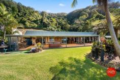 266A Shephards Lane Coffs Harbour NSW 2450 $1,250,000 Privately positioned at the base of a National Park and with a beautiful outlook to the ocean and mountains 'Zenvale' could be the perfect opportunity to escape the rat race and move to the spectacular Coffs Coast region. Situated on just over 10.5 acres this lifestyle property offers the lucky buyer space and privacy less than 10 minutes drive from the Coffs Harbour CBD. The home itself is a great size and consists of 4 bedrooms, 2 bathrooms, large open plan living space, separate dining and a neat & tidy kitchen. For the entertainer this is definitely the home for you. The outdoor entertaining area is enormous and is the perfect spot to sit and relax or invite your friends over for a party and take advantage of the wood fired oven and barbecue area. For those that want shedding or a workshop this home also has you covered with a large area that is currently being used as a workshop but could easily be converted in parking or shed space. Access to the property is via a fully sealed driveway which is well maintained and stops right outside the entrance to the home. As an added bonus my current owners have also cut out another house pad if someone was wanting to have a dual occupancy property subject to council approval. The land itself has also been improved and separated into paddocks for animals, plus there is already a chicken coop and numerous fruit trees planted around the property. With so much to offer there are so many advantages to owning this property. If you've been looking for an escape that is still within close proximity to the CBD then look no further as this home has all bases covered.