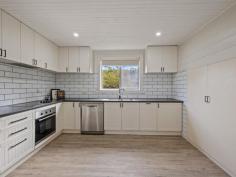 5 Stanley St Toora VIC 3962 $440,000 Enjoying a convenient location right in the heart of this picturesque Historic township, with glimpses of the Inlet from the front verandah, this charming cottage is ready to move in and enjoy. Stylishly updated to combine the features of the era - high ceilings, four panel doors, timber lining boards - with every requirement of a modern lifestyle. Central hallway leading to a delightful lounge room with RC/AC and original hearth. Magnificent country style kitchen with subway tiles, gleaming cabinetry and brand new appliances. Separate dining room with rustic lining boards and views out over the rear garden. Quality timber look planking throughout the living areas and brand new carpeting in the bedrooms. Stunning modern bathroom with large frameless shower recess, w.c. and vanity. Set on a fully fenced block of approx. 524m2 with laneway access to a double carport and LU shed / workshop. With all the hard work done, this is perfect for lovers of period homes that do not want to renovate. Walk to the cafe, gallery, pub, medical centre, heated public pool, bowling club, parkland and Great Southern Rail Trail; or 2km to boat launching into the sheltered waters of Corner Inlet. For full time or fun time, this is a great opportunity.