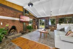 767 Trees Road Currumbin Valley QLD 4223 $1,995,000 10 Acre Natural Wonderland With Vast Coastline Views Dreaming of a tree change? Swap urban chaos for rural tranquillity and retreat to a 10 acre natural wonderland in Tallebudgera Valley. Hovering 300m above sea level and basking in spectacular views, a rolling tapestry of greenery sprawls out to meet the magnificent coastline, with the Pacific Ocean sparkling on the distant horizon. Co-existing in harmony with its surrounds is a charming mud brick home that speaks to the simplicity of life here among the treetops. Accessed by a newly sealed bitumen driveway, the exposed rock flooring, timber panelled walls and louvred windows reinforce the character of the unspoilt surrounds, while also keeping it naturally cool. Raked ceilings with timber beams and a feature mud brick wall enhance the earthy charisma in the lounge room, while the kitchen has been modernised with sleek white cabinetry and new appliances to complement the original stove. Two bedrooms and one bathroom grace the floorplan too, with the master bedroom offering enhanced peace and privacy via a private entry. A second bedroom features a built-in robe and handy direct access to a light-filled bathroom/laundry. There's ample room to relax on the outdoor deck that wraps around the side and the rear of the home, with flat grazing areas and a summer creek meandering through this lush bushland paradise as well. The 30kW solar system and a 50,000L water tank cater to an off-grid lifestyle, plus the home hosts a new and insulated 4-bay carport. There's even a cleared section overlooking Springbrook Mountain and Currumbin Valley, ready for you to build a second residence. Supremely peaceful and private, this idyllic oasis is conveniently just 11 minute's drive from Tallebudgera State School and shops/amenities (approx.), with beautiful beaches and coastal cafes of Palm Beach and Burleigh beckoning in 20 minutes (approx.). Experience the serenity, seclusion and enticing potential firsthand – arrange your inspection today. Main House Features 10 acre parcel of paradise with vast views stretching towards the coast Completely off-grid lifestyle on offer Charming mud brick and timber construction home Exposed rock flooring and louvre windows throughout Modernised kitchen with dual sink, 4 burner gas cooktop and oven, built-in pantry, original stove/oven and a 3-seater breakfast bar overlooking deck Lounge beneath 3.2m raked ceilings with exposed timber beams plus feature mud brick wall, wood fireplace, built-in cabinetry and sound system Master bedroom with louvre windows, storage room and private entry Bedroom 2 with built-in robe and access to light-filled bathroom/laundry Outdoor entertaining deck which wraps around half the home Other Features Cleared section for another building pad overlooking Springbrook Mountain and Currumbin Valley 30kW solar system with 60 panels Gas hot water New insulated four-bay carport Woodshed Shed with work bench and storage Flat grazing areas throughout the property Summer creek 50,000L water tank Located 300m above sea level Bitumen driveway, lined by a new concrete/rock retaining wall at the end section Location Approx. 11 mins to Tallebudgera State School and shops/amenities Approx. 15 mins to St. Andrew's Lutheran College Approx. 18 mins to The Pines, Elanora Approx. 19 mins to Palm Beach Approx. 20 mins to Burleigh Heads Approx. 20 mins to Currumbin Beach Approx. 26 mins to Gold Coast Airport Approx. 40 mins to Surfers Paradise