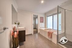 20 Oakview Blvd Narre Warren North VIC 3804 $1,750,000 - $1,800,000 Situated in an exclusive tree-fringed boulevard at the highly sought-after Oaktree Rise Estate, number 20 Oakview Boulevard projects a commanding presence from its wide-fronted 884m², elevated setting. Of immediate attraction is its superb three-car garage with drive-through access for further vehicle storage. A wide, exposed aggregate parking apron permits ample family or guest parking too. Step inside and a wonderful light-filled and spacious interior beckons. Features include an independent lounge with stunning views across the adjacent wetlands, a fully fitted and beautifully functional home office/study with a downstairs powder room adjoining the family-sized laundry. A fully equipped theatre lounge is also featured, it includes chic window shutters and an acoustic ceiling panel with starry light board effects - a living room with appeal both day & night! Perhaps the most alluring aspect of the home is the kitchen and surrounds, featuring twin ovens, stone benches, a walk-in pantry/scullery, and an enormous full-length bench extending into the dining zone, making it an ideal space for casual family gatherings or serious culinary exercises - Flowing seamlessly to the outdoors as you step out through sliding stacker doors to the alfresco deck. A large, paved area is then joined by the fabulous heated inground swimming pool in a fully fenced enclosure. Low maintenance and hassle-free it’s sure to be a focus of outdoor life this summer! Upstairs there is the family retreat with a private balcony and a total of four double bedrooms. The generous master suite enjoys fabulous views and features his and her walk-in robes and a beautifully appointed ensuite. Storage is not an issue with all remaining rooms complete with walk-in robes, one provides a great option for guests or larger families with its own private ensuite. Relish the harmony of suburban living while remaining well-connected to urban amenities. Excellent schools, parks, shopping, and dining options are just a stone's throw away. Properties in this location never last long! Don't miss the opportunity to make this stunning home your own and embark on a new chapter of luxury living.