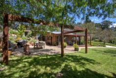 165 Translator Road Armidale NSW 2350 $1,350,000 Discover a peaceful and private rural paradise spanning 9.57 hectares, just a short 5-minute drive or bike ride from the CBD and airport. 'Applegum Ridge' is set on the fringe of the fast-growing town of Armidale, NSW. Armidale is located in the heart of the New England Region with easy access via road, rail, and air to metropolitan centres. Armidale is well-known for its proximity to world heritage national parks, excellent educational opportunities, including the University of New England and TAFE NSW Digital Hub. The main residence is a solar passive double brick building with four bedrooms, featuring built-in robes. The master bedroom comes with an ensuite, there is a three-way bathroom to service the other bedrooms. The living room boasts a soaring timber-clad vaulted ceiling and a cosy fireplace, while the kitchen combines country-style charm with modern appliances. The house is designed for solar passive heating in winter and cooling in summer, perfectly complementing the four-season garden. Outside, you can enjoy the landscaped garden, basalt stone walls, a waterfall, and a variety of deciduous trees, along with your very own olive grove. The property offers numerous entertaining areas with a patio and deck, providing great spots for relaxing with family & friends and enjoy the panoramic views. The property features four water tanks, a workshop/machinery shed, and well-maintained yards servicing six paddocks, suitable for horses and livestock enthusiasts. Additionally, there is a self-contained one-bedroom guest cottage that can be used as an office or extra accommodation. It features an open-plan kitchen, living, and dining area with new reverse-cycle a/c, as well as a bedroom, bathroom, and single carport. This tranquil retreat with sweeping rural views awaits your discovery. Don't miss your opportunity to own this 9.57ha rural paradise, offering both serenity and convenient town access.