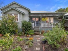 25 Coopers Rd Foster VIC 3960 $685,000 'Portsea'- Prepare to fall in love with this character filled cottage set on approx. 2944m2 of magnificent gardens right on the edge of town. Sighted to capture lovely views over the rural setting in this exclusive peaceful location, it is difficult to believe that the centre of town is only a 5 minute walk away. The sundrenched front verandah is just the spot for morning coffee and opens into the delightful entrance foyer. Period features such as polished flooring, high ceilings, fretwork and picture rails create the charm of a bygone era whilst the open interior caters for a modern lifestyle. Generous formal living / dining room with box bay window and wood heater. Central modern kitchen with island bench / servery to meals area (RC/AC) and doors out to a covered entertaining deck. Two large fitted bedrooms plus study/studio space , ideal for working from home. Huge central bathroom with statement claw foot bath, upsized shower recess and heritage style vanity. Expansive fitted laundry / utility room with second w.c. Rambling cottage gardens with a fringe of native trees attracting local birds and wildlife, even visiting koalas - see if you can spot one in the photos! There is a sheltered courtyard with veggie beds, and an open grassy area with extensive orchard, garden shed, carport and guest parking area. If you are looking for a country setting with walk to town convenience, this is a must see.
