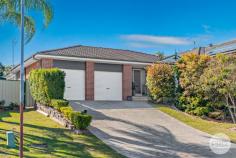 5 Charthouse Avenue Corlette NSW 2315 Situated in a quiet pocket in the family friendly suburb of Corlette and featuring a meticulously maintained façade, exuding a sense of tidiness and curb appeal, sits this ultimate single-level family home. Step inside and discover the epitome of comfort and modern living. The interiors are drenched in natural light which perfectly complements the calm colour palette and warm timber finish flooring to accentuate the spacious interiors. The layout flows seamlessly, with two distinct living areas that provide flexibility and space for various activities. The open-plan design enhances the sense of connectivity, allowing for easy interaction between the kitchen, dining, and living spaces. A sublime, contemporary kitchen fit with stainless steel appliances, crisp cabinetry, and an elegant island bench provides the ultimate space to entertain guests in a central hub. For those who love to entertain, the undercover entertainment area offers a picturesque setting to host gatherings, all while overlooking the expansive backyard. Boasting four generously sized bedrooms, each featuring built-in wardrobes and ducted air-conditioning, there's plenty of room for the whole family to reside in comfort while the two bathrooms, including an ensuite attached to the main bedroom, offer a perfect blend of original charm and cleanliness while you unwind after a long day. Situated in the peaceful enclave of Corlette, this home is a serene retreat from the bustling nature of everyday life, allowing you to relish the tranquillity of the surroundings. Experience the perfect blend of modern comforts and serene living in this exquisite property. Location, design, inclusions, functionality, luxury and quality - this home has it all and more! Approx. a 1km walk to Corlette Beach, there will be no excuses not to see the sunrise or sunsets.