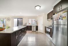 29 Mayesbrook Rd Manor Lakes VIC 3024 Presenting a residence that boasts three generously sized bedrooms, this property enjoys a prime location in close proximity to the Wyndham Train Station and local schools. The master bedroom is equipped with His and Her robes as well as an ensuite, and features such as a ceiling fan and hybrid wooden floors enhance the ambiance. With a focus on convenience, the double garage offers remote control access and internal entry. The kitchen, designed for spaciousness, is complete with modern amenities including a dishwasher and ample storage solutions. Additional highlights of this home include built-in robes in the second and third bedrooms, ducted heating, and evaporative cooling for year-round comfort. The outdoor area, designed for low maintenance living, features a concrete pathway, pergola, and a practical garden shed.