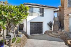 2/55 Johnson Street Kiama Downs NSW 2533 Have you been looking for a unit, but don't like the idea of high strata fees and complicated strata schemes? Then look no further, this cute little home allows you the luxury of living independently on a small, neat parcel of land and the ability to lock up and leave whenever the desire takes you! Located in a quiet cul-de-sac this neatly maintained, recently renovated family home has unrestricted access to Jones Beach and gorgeous coastal walks. Acting as a staple for south coast living at its finest, be at the beach in one minute with a surfboard tucked under your arm or a towel to soak up the sun. Lifestyle, location and convenience are what this home prides itself on. This property is perfect for the first home buyer, downsizer or those looking for that lock-and-leave holiday destination you can't wait to escape to. The property comprises three bedrooms, two bathrooms, a modern kitchen, open dining and living areas as well as a downstairs area that is currently set up as a work-from-home opportunity, alternatively, this could be used as a separate living area, 4th bedroom or teenage retreat. Further highlights to mention are the ducted air conditioning throughout and the built-in wardrobes in all bedrooms. To the rear of the property is the easy-to-maintain yard and undercover outdoor entertaining area, perfect for friends and family. A larger-than-normal single garage with bucket loads of storage completes this pretty picture. Walk 350m down the road and be met with your local grocer, pharmacy and cafes, or take advantage of Kiama Downs access to Shellharbour and Wollongong being only a 10 and 20-minute drive respectively.
