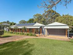 27 Allara Street Flaxton QLD 4560 $975,000 Perched at the end of a stunning tree-lined and serenely tranquil cul-de-sac is the beautiful 27 Allara Street, Flaxton. Set upon a gorgeous 2.2-acre parcel of land, this remarkable property offers a sense of serenity and grandeur, with captivating views overlooking a magnificent spring-fed dam. Step inside the single-level brick home and be greeted by a harmonious blend of character and modern allure. Boasting four spacious bedrooms, including a master retreat complete with an ensuite and a walk-in robe, this home exudes both charm and functionality. The layout has been thoughtfully designed with the modern family in mind, ensuring optimal separation and privacy for every resident. Prepare to be inspired in the expansive, modern kitchen adorned with stone benchtops, an inviting island bench, a walk-in pantry, and a gas cooktop. As you craft your culinary creations, let your gaze wander across the stunning backdrop of rolling green hills and the mesmerising dam, transforming every cooking experience into a work of art. Unwind and immerse yourself in the spacious lounge room, where you can indulge in your favourite series or movie. The added touch of a cosy fireplace sets the perfect mood for relaxation and blissful moments of tranquillity. Embracing sustainable living, this property is fully self-sufficient, featuring a 5kW solar power system, solar heating, and two generously sized water tanks. An efficient irrigation system is seamlessly connected throughout the property, drawing from the dam to keep the gardens vibrant and thriving. Situated just a few minutes' drive from the charming Montville and Mapleton Villages, and a mere 30 minutes from the breathtaking northern beaches, Flaxton offers the epitome of affordable acreage living. Here, you can enjoy the best of both worlds-an idyllic countryside lifestyle complemented by convenient access to modern amenities.