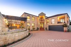 20B Cookham Road Lathlain WA 6100 $1,100,000 This elegant family home is perched in one of Lathlain's most sought-after pockets. The residence boasts numerous indoor living areas, large bedrooms, and stunning finishes throughout. Ideally located close to the city, vibrant amenities, and great schools, an enviable lifestyle is on offer! Set on the crest of tree-lined Cookham Road, this position delivers incredible views of Perth City. A charming two-storey facade opens with a foyer-style entry. You will immediately notice the beautiful marble tiling and high ceilings which provide a considerable sense of space. This home is perfect for the entertainer, with so much living space on offer. The formal lounge is complete with a bar and seamlessly connects to the outdoor alfresco. Two secondary bedrooms, one of which is larger and has access to the semi-en-suite, ensure ample space for a growing family. Transitioning upstairs via an elegant staircase, you will notice the tasteful solid wood flooring. The open-plan kitchen, living and dining room is complete with a wrap-around stone bench top, premium appliances and generous amounts of bench and cupboard space. Beyond the kitchen, there is an open-plan family and study - there really is so much living space on offer here! The palatial master suite is complete with a walk-in robe and en-suite, delivering the ideal parental retreat. Property Features: ● Elegant double-storey home ● Double garage with storage ● Spacious alfresco set to the side of the home ● Downstairs lounge with built-in mini-bar ● Two large secondary bedrooms with robes, one of which is larger and will suit as a guest suite ● Primary bathroom with shower and vanity ● Wide, elegant staircase ● Separate powder room ● Open plan kitchen, living and dining room ● Gourmet kitchen with wrap-around bench, stone bench top, Smeg oven and cooktop, pantry, lots of cabinetry ● Open-plan family room and study ● Two separate balconies ● Spacious master suite with walk-in robe and en-suite with double vanity, shower, spa bath and separate powder room ● Premium marble tiling ● Timber flooring upstairs ● Two split systems and ducted reverse cycle air conditioning throughout ● 5KW Solar Panels ● Block Size: 505 sqm ● Water Rates: $1,355.59 pa ● Council Rates: $2,466.84 pa