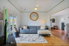 20 Ferguson St Cessnock NSW 2325 $530,000 - $550,000 – This charming weatherboard cottage is located in a popular street only a stones throw away from the centre of town – A full hedge and feature olive tree set the scene and invites you to the front door – Upon entering the home you are met by beautiful features of yesteryear with stunning timber flooring, high ceilings, dado rails, coloured feature glass and French Doors opening to the front and rear of the home – The two bedrooms are bright and generously sized, the second bedroom features an ornamental fireplace and A/C. Both bedrooms have ceiling fans – The colour scheme is fresh and bright throughout and a nod to the history of the home with feature painted rails in a heritage style colour – The easy flow floorplan offers a spacious living room in the middle of the home that continues through to the dining and kitchen – The practical kitchen is equipped with substantial storage, preparation space and a free-standing electric oven – The large bathroom really fits the feel of the home and there is a second toilet to the rear of the home near the internal laundry – The rear French doors open to the covered alfresco space that overlooks the captivating and picture perfect established gardens, a real feature of the home and a wonderful, private oasis! – There is a lock up garden shed that provided ample storage space for the tools and garden equipment – Externally there is nothing to do with the cottage having a full external paint and new colorbond roof – The package is finished off by a fully fenced yard on a 626m2 block with side access from the laneway – This is a property sure to catch attention with its charming style, so be sure to be quick!